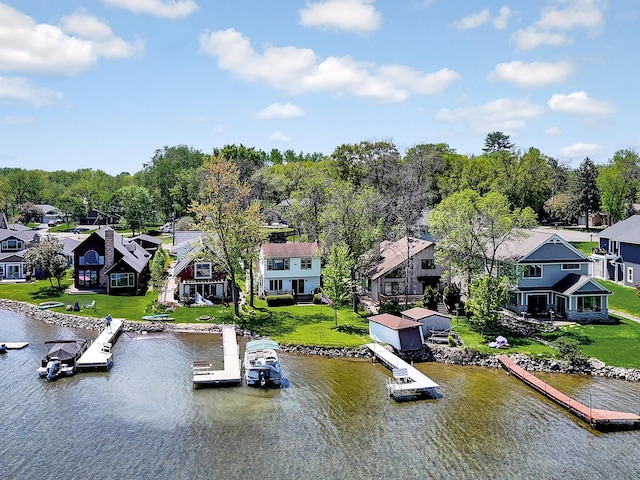 1379 7th Ave SE, Forest Lake, MN 55025 - dock featuring a residential view, a water view, and a lawn