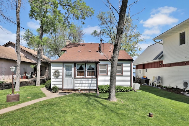 1379 7th Ave SE, Forest Lake, MN 55025 - rear view of property featuring a yard and a shingled roof
