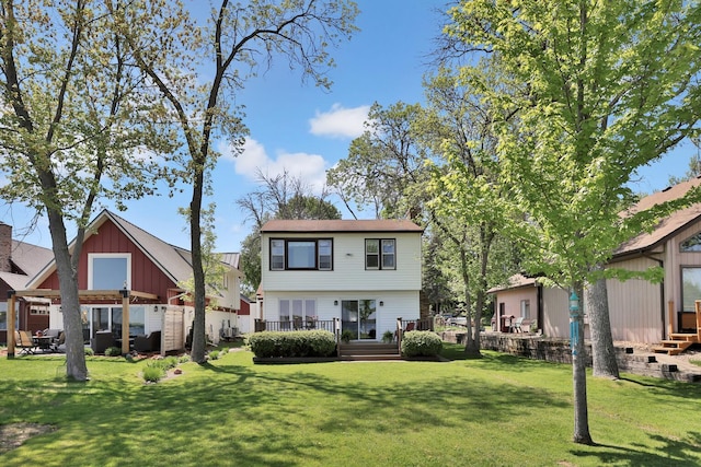 1379 7th Ave SE, Forest Lake, MN 55025 - back of property with a lawn, board and batten siding, and a wooden deck