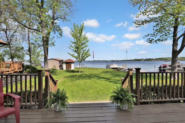 1379 7th Ave SE, Forest Lake, MN 55025 - wooden deck with a water view, a lawn, and a boat dock