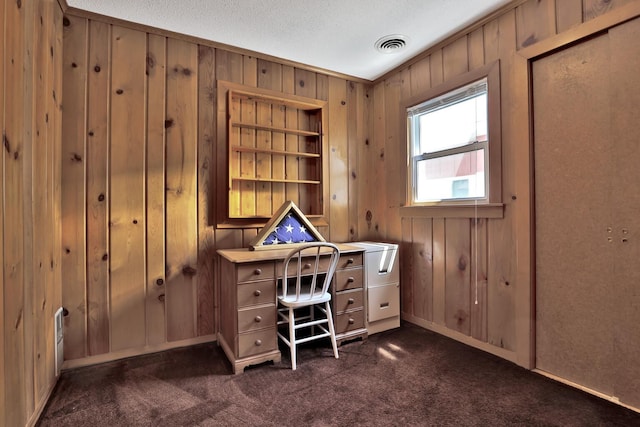 1379 7th Ave SE, Forest Lake, MN 55025 - office space with wood walls, dark carpet, and baseboards