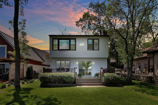 1379 7th Ave SE, Forest Lake, MN 55025 - back of property featuring a deck and a lawn