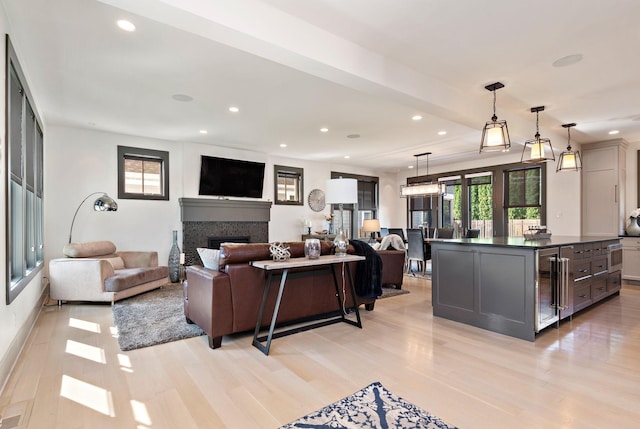 5808 Oaklawn Ave, Edina, MN 55424 - living room with wine cooler, light wood-style flooring, recessed lighting, and a fireplace