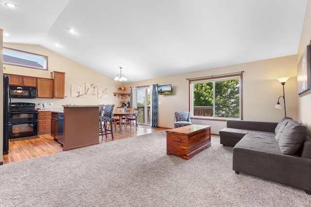 829 Dubuque Blvd, Zumbrota, MN 55992 - living room featuring lofted ceiling, a chandelier, light wood-style floors, and recessed lighting