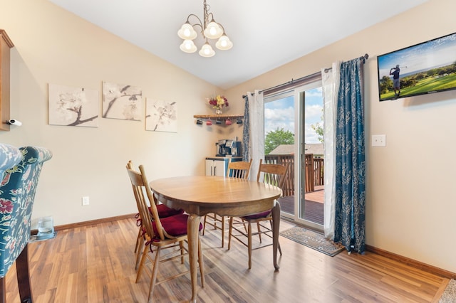 829 Dubuque Blvd, Zumbrota, MN 55992 - dining area featuring a chandelier, lofted ceiling, and wood finished floors