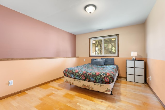 829 Dubuque Blvd, Zumbrota, MN 55992 - bedroom featuring wood finished floors and baseboards