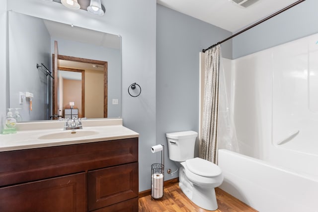 829 Dubuque Blvd, Zumbrota, MN 55992 - full bath with wood finished floors, vanity, and shower / tub combo