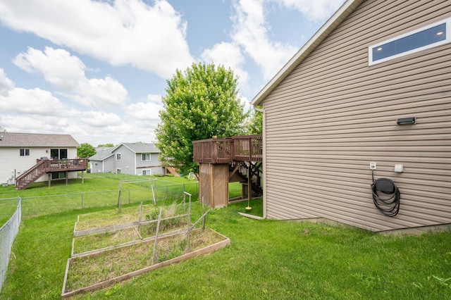 829 Dubuque Blvd, Zumbrota, MN 55992 - view of yard featuring a deck, a garden, and stairway