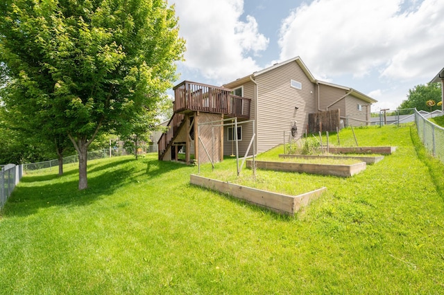 829 Dubuque Blvd, Zumbrota, MN 55992 - back of house featuring a deck, a garden, a fenced backyard, and stairs