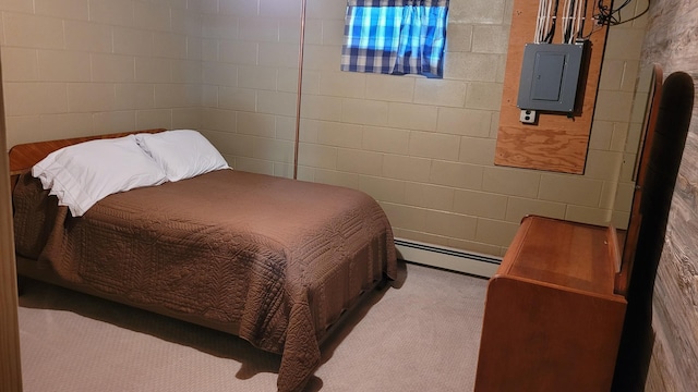 carpeted bedroom featuring baseboard heating and electric panel