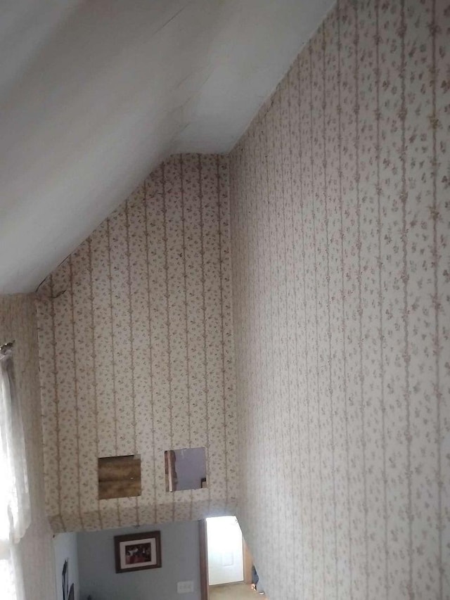411 5th St, Montevideo, MN 56265 - bonus room featuring lofted ceiling and wallpapered walls