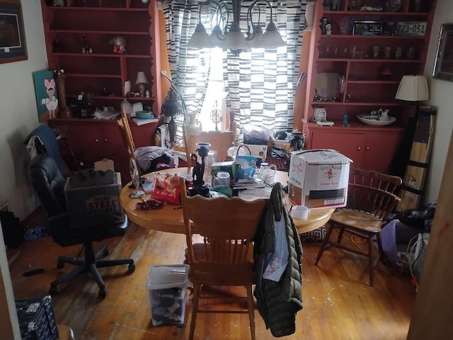 411 5th St, Montevideo, MN 56265 - home office featuring wood finished floors and a chandelier