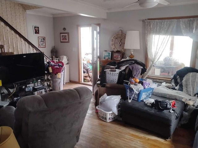411 5th St, Montevideo, MN 56265 - living area with wood-type flooring, crown molding, and stairs