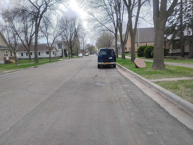 411 5th St, Montevideo, MN 56265 - view of asphalt road with curbs and sidewalks