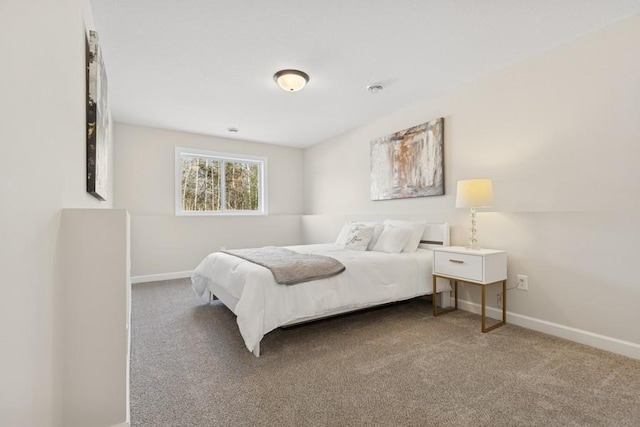 carpeted bedroom with baseboards