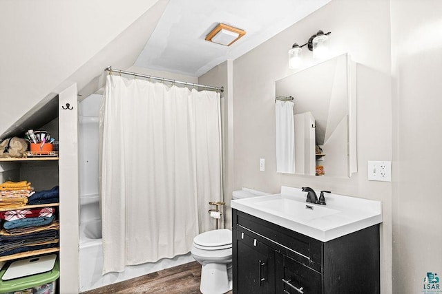 full bathroom featuring toilet, wood finished floors, vanity, and shower / tub combo with curtain