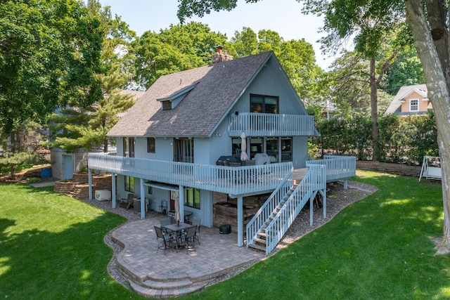 1749 Avocet Ln, Mound, MN 55364 - back of house featuring a shingled roof, a balcony, a patio, and a yard