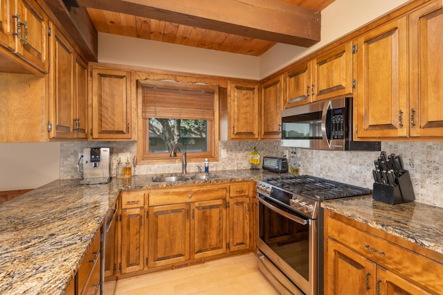 1749 Avocet Ln, Mound, MN 55364 - kitchen featuring appliances with stainless steel finishes, brown cabinetry, decorative backsplash, stone countertops, and a wood ceiling with exposed beams