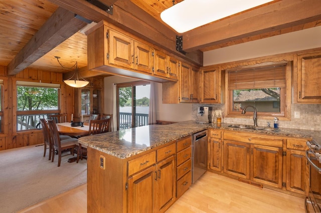 1749 Avocet Ln, Mound, MN 55364 - kitchen with appliances with stainless steel finishes, brown cabinets, stone countertops, a peninsula, and light wood-style flooring