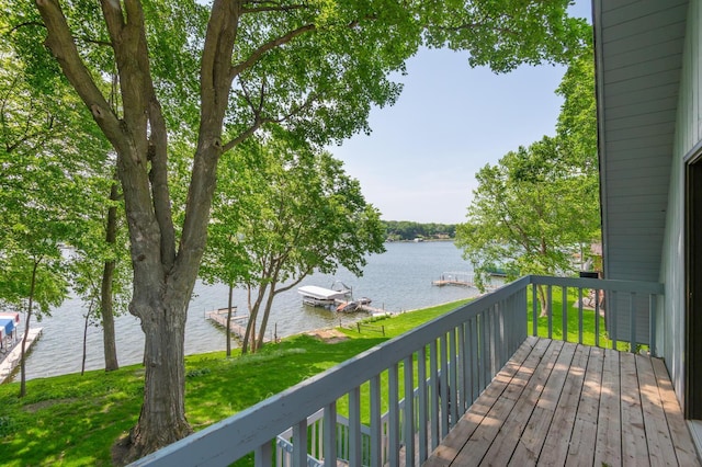 1749 Avocet Ln, Mound, MN 55364 - wooden deck featuring a water view, a lawn, and a boat dock