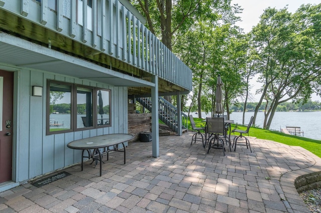 1749 Avocet Ln, Mound, MN 55364 - view of patio featuring stairway, a water view, and outdoor dining area