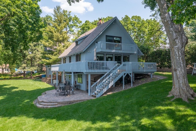 1749 Avocet Ln, Mound, MN 55364 - back of house featuring a balcony, a chimney, a patio area, roof with shingles, and a yard