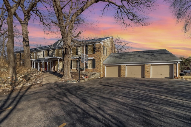 1345 Crestridge Ln Unit 203, Eagan, MN 55123 - view of front of home featuring brick siding and driveway