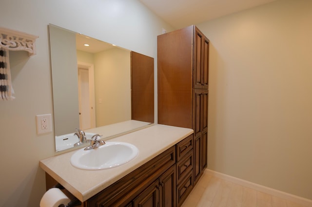 1345 Crestridge Ln Unit 203, Eagan, MN 55123 - bathroom with vanity, baseboards, and recessed lighting