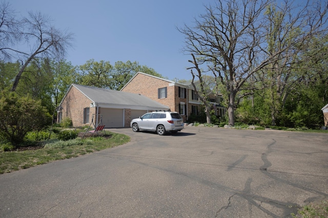 1345 Crestridge Ln Unit 203, Eagan, MN 55123 - view of side of property with brick siding and an attached garage