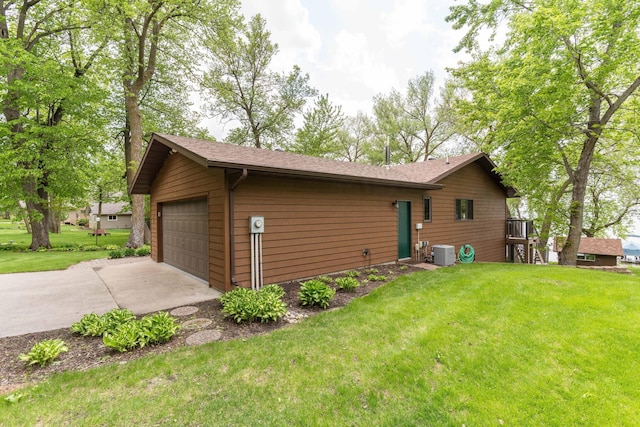 22005 Statesboro Trl, Clitherall, MN 56524 - view of side of property with cooling unit, a yard, a garage, and roof with shingles
