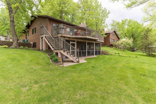 22005 Statesboro Trl, Clitherall, MN 56524 - rear view of house featuring a deck, stairs, a lawn, and a sunroom