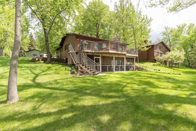 22005 Statesboro Trl, Clitherall, MN 56524 - back of property with a deck, stairway, a lawn, a chimney, and a sunroom