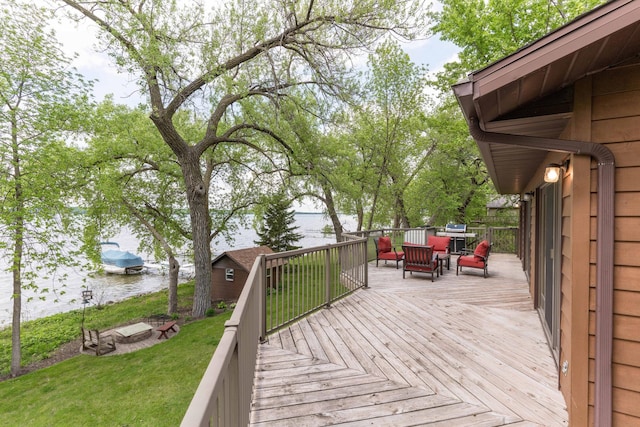22005 Statesboro Trl, Clitherall, MN 56524 - wooden terrace featuring a water view, a lawn, and an outdoor hangout area