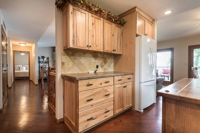22005 Statesboro Trl, Clitherall, MN 56524 - kitchen featuring freestanding refrigerator, dark wood finished floors, light brown cabinets, decorative backsplash, and recessed lighting