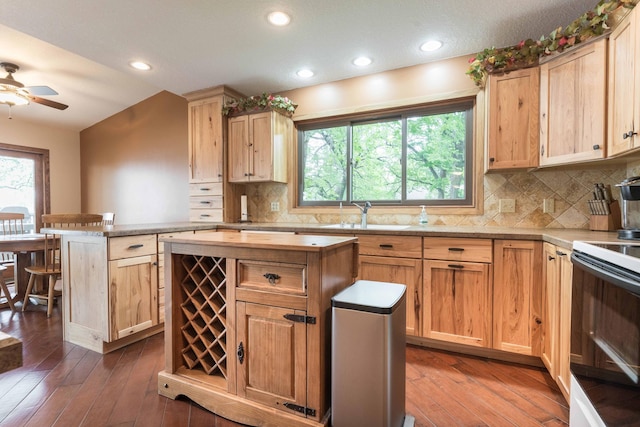 22005 Statesboro Trl, Clitherall, MN 56524 - kitchen featuring white range with electric cooktop, a sink, a kitchen island, light brown cabinets, and recessed lighting