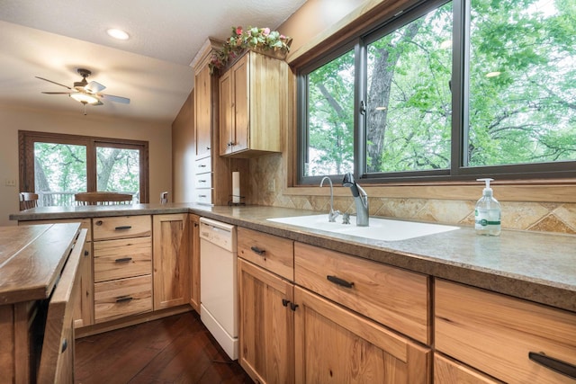 22005 Statesboro Trl, Clitherall, MN 56524 - kitchen featuring white dishwasher, a sink, a ceiling fan, a peninsula, and dark wood finished floors