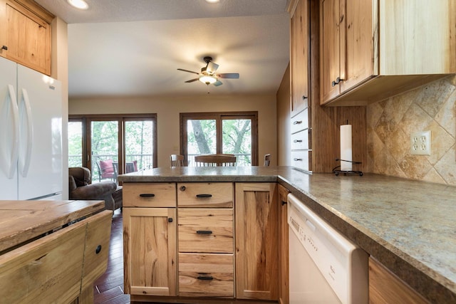 22005 Statesboro Trl, Clitherall, MN 56524 - kitchen featuring white appliances, a peninsula, a ceiling fan, backsplash, and recessed lighting