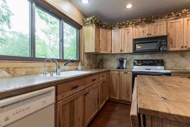 22005 Statesboro Trl, Clitherall, MN 56524 - kitchen with dishwasher, black microwave, a sink, tasteful backsplash, and recessed lighting