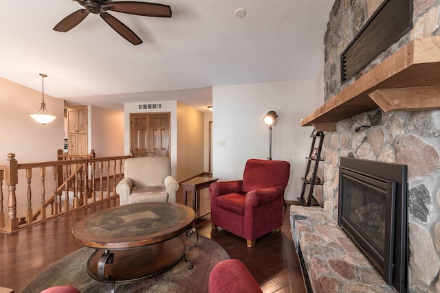 22005 Statesboro Trl, Clitherall, MN 56524 - living area with hardwood / wood-style floors, a ceiling fan, a fireplace, and baseboards