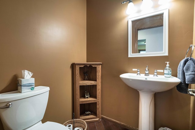 22005 Statesboro Trl, Clitherall, MN 56524 - bathroom with toilet, wood finished floors, and baseboards