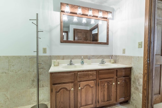 22005 Statesboro Trl, Clitherall, MN 56524 - full bathroom with double vanity, tile walls, and a shower with shower door