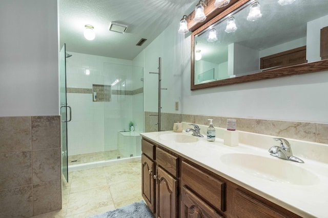 22005 Statesboro Trl, Clitherall, MN 56524 - bathroom with a stall shower, double vanity, tile walls, and tile patterned floors