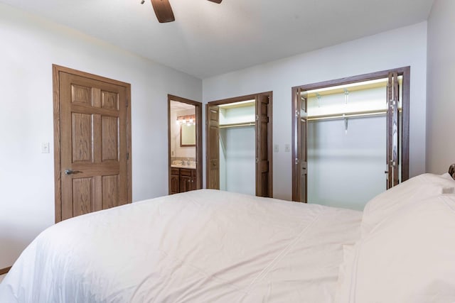 22005 Statesboro Trl, Clitherall, MN 56524 - bedroom with ensuite bath, ceiling fan, and multiple closets