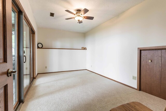 22005 Statesboro Trl, Clitherall, MN 56524 - unfurnished bedroom with light carpet, baseboards, and ceiling fan
