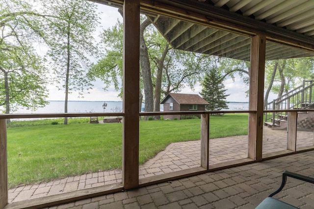 22005 Statesboro Trl, Clitherall, MN 56524 - doorway featuring a water view and brick floors