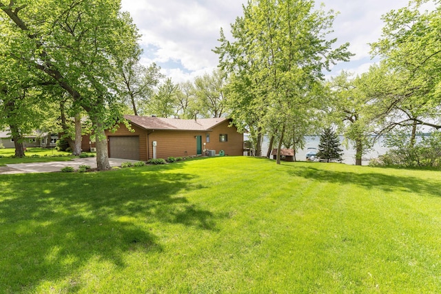 22005 Statesboro Trl, Clitherall, MN 56524 - view of green lawn featuring an attached garage and driveway