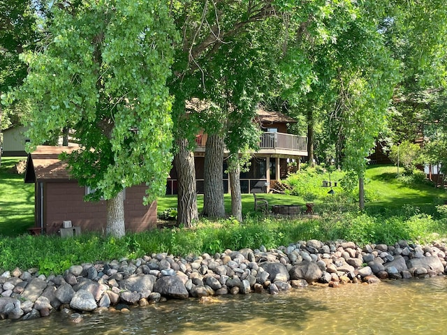 22005 Statesboro Trl, Clitherall, MN 56524 - rear view of house with a deck with water view and a lawn