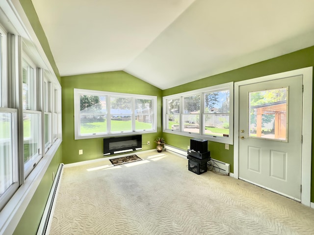 sunroom / solarium featuring a baseboard heating unit and vaulted ceiling