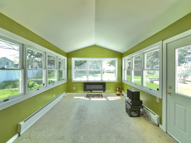 unfurnished sunroom with vaulted ceiling, baseboard heating, baseboards, and carpet