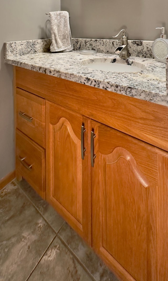 bathroom with tile patterned floors and vanity
